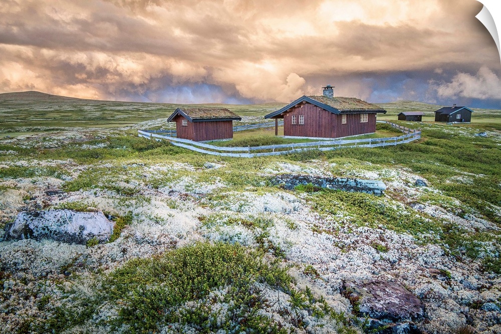 A photograph of a Norwegian landscape with post storm clouds hanging overhead.