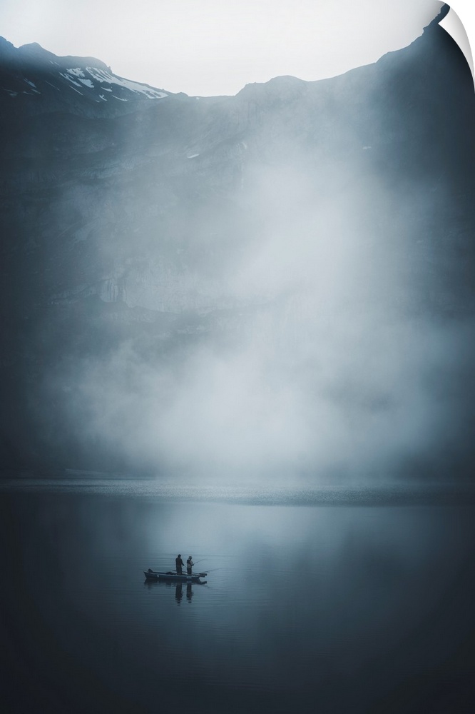 Fishermen on a boat in the middle of the mist