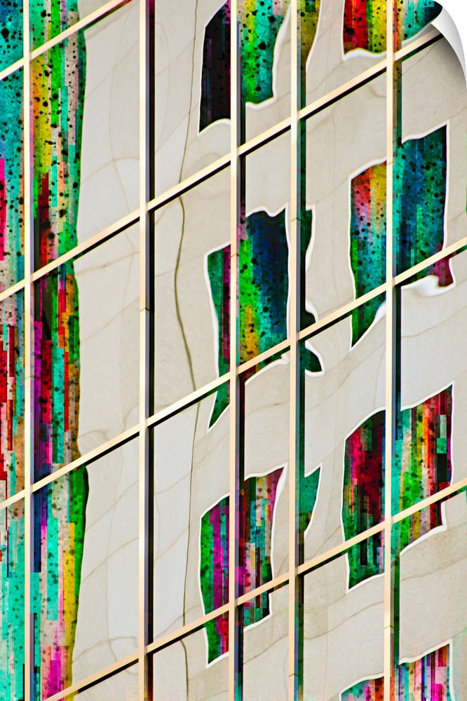 Abstract photograph of a warped image of colorful windows, reflected in the side of a skyscraper.