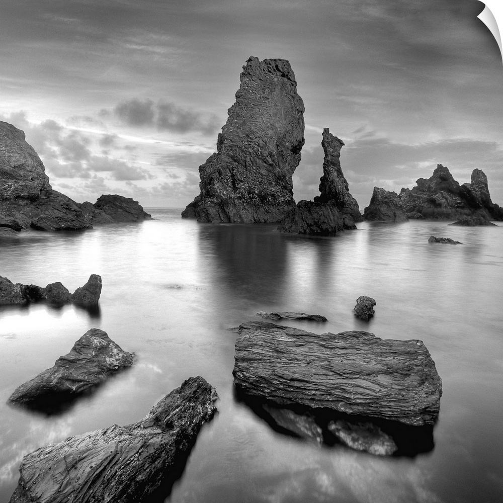 Big natural rocks in Belle Ile en Mer beach called Port coton in France, Brittany, black and white picture.