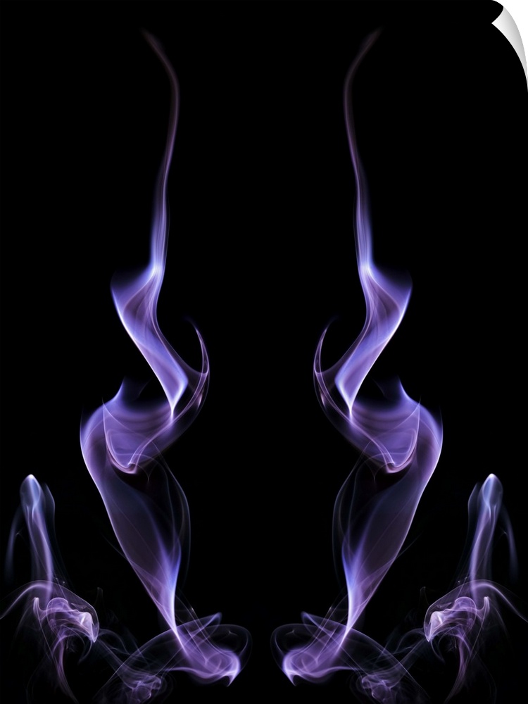 Abstract symmetrical image of purple colored smoke, resembling fire.