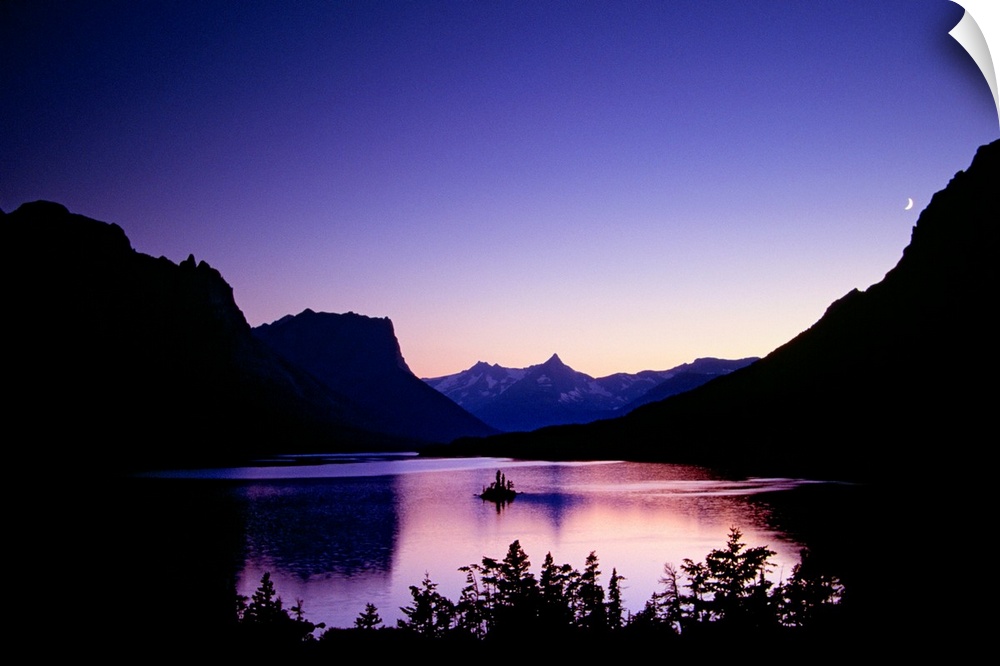 Mountainous terrain is silhouetted by the sunset and a large body of water sits in between. A small crescent moon is shown...