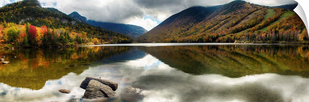 Fine art photo of mountains reflected in a lake in New Hampshire in autumn.