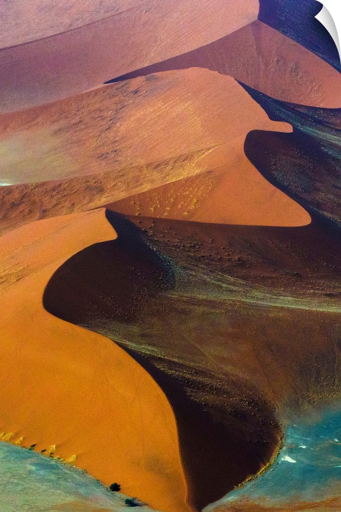Fine art photo of giant sand dunes of varying colors in Namib-Naukluft National Park, Namibia.