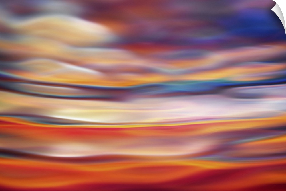 Abstract photograph in orange and red shades resembling ocean waves.