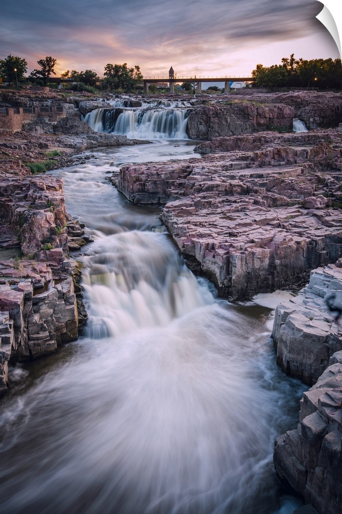 Cascading waterfall in Sioux Falls South Dakota during sunset.
