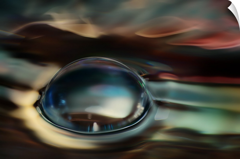 Abstract photograph of blurred and blended colors and flowing lines with a large bubble in the center.