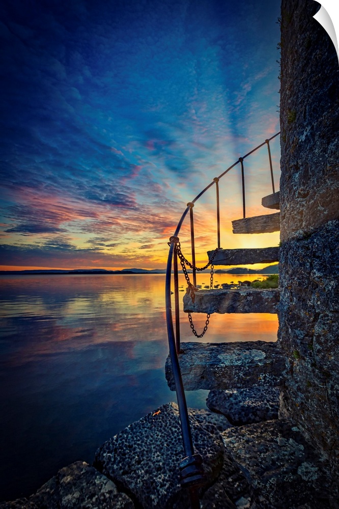 Sunset over an Irish lake with stairs in the foreground
