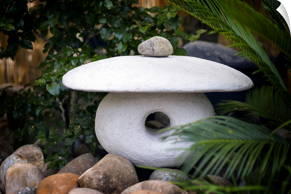Fine art photo of a zen sculpture made of three carved stones.