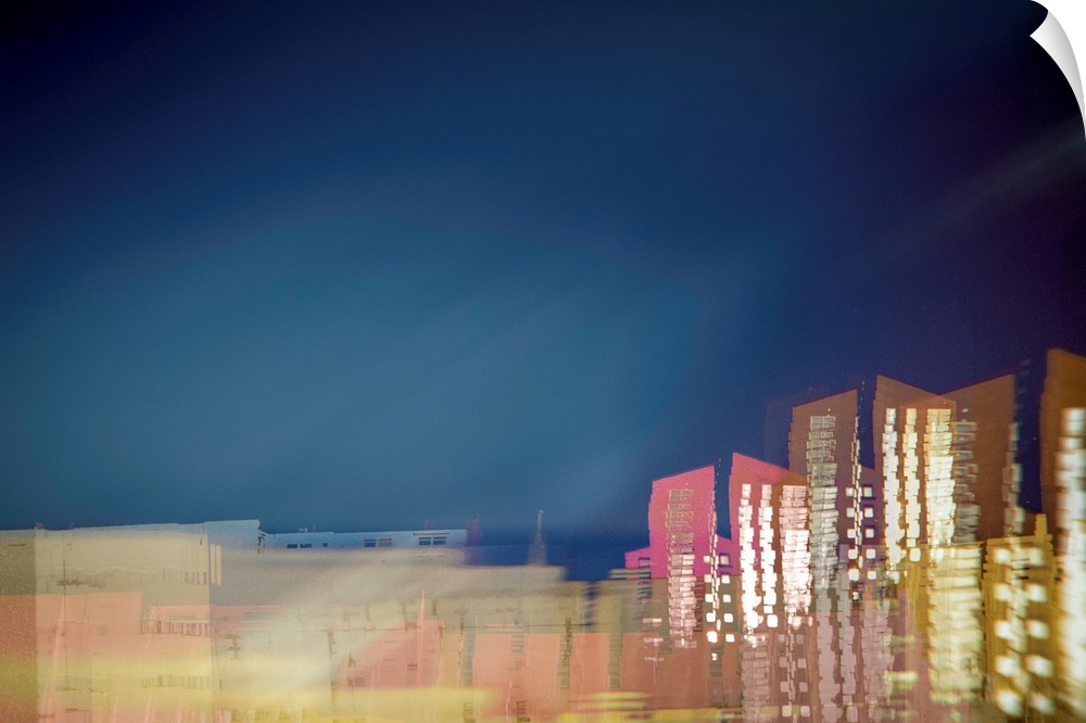 Long exposure photograph of a city skyline with movement and distortion.