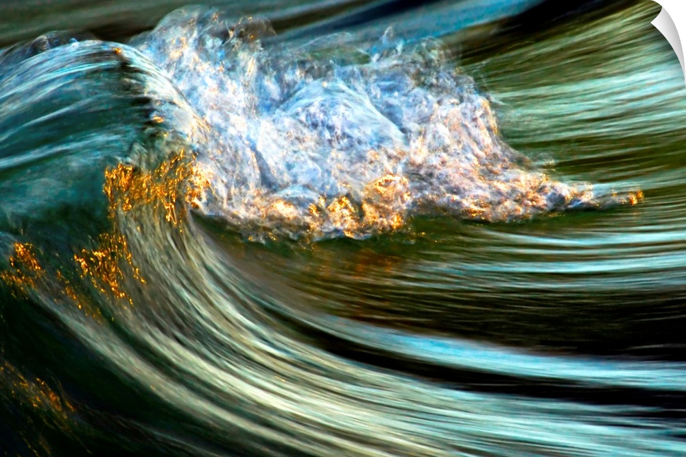 Big photograph focuses on the crest of a wave as it begins to fold over and crash against itself.