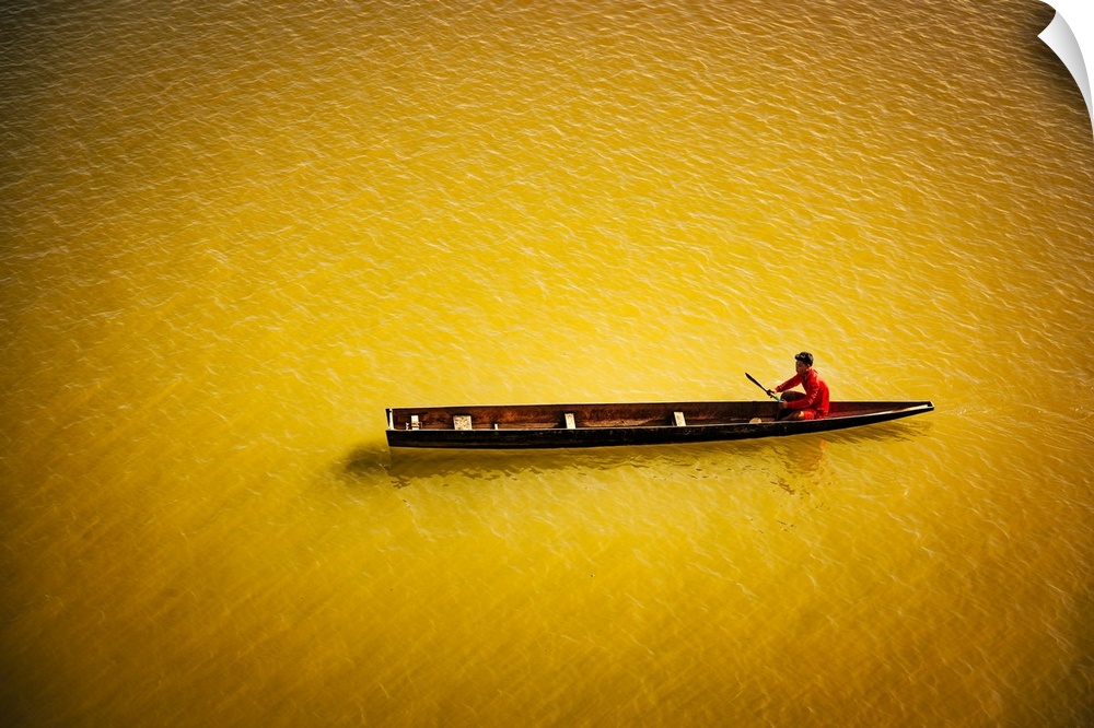 A man in his boat on the Mekong in Laos