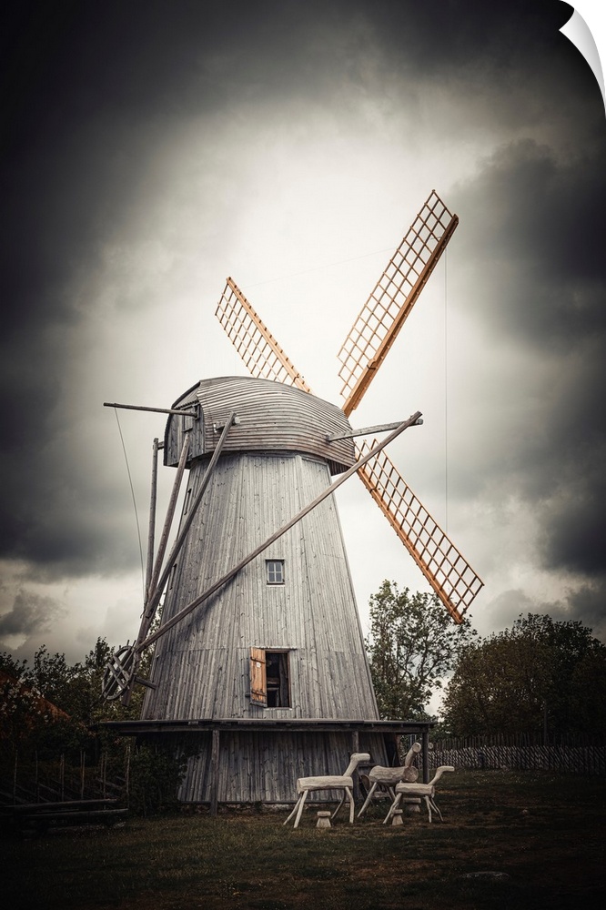 Old windmill close up with stormy sky