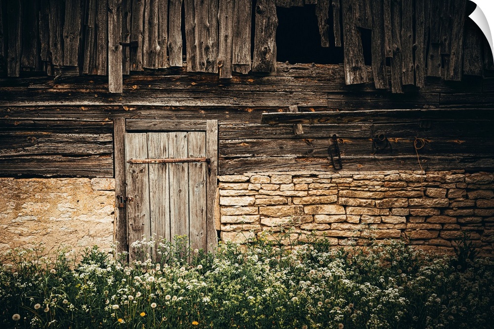 Wooden door of an old stone house
