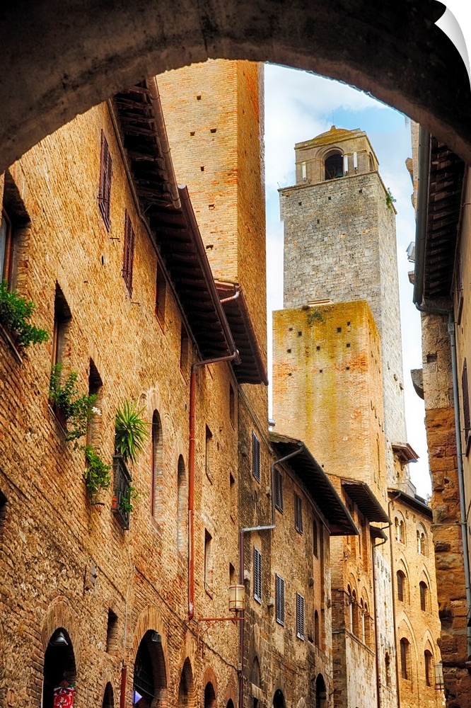 A photograph of stone buildings and tower in Italy.