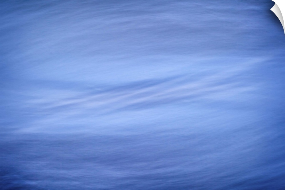 A cool blue contemporary minimal zen-like image of blue and silver swirls.