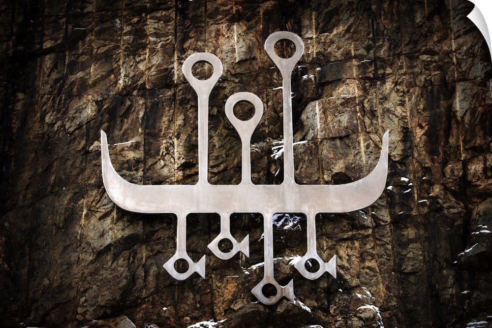 A photograph of a tributary metal carved symbol of the vikings.