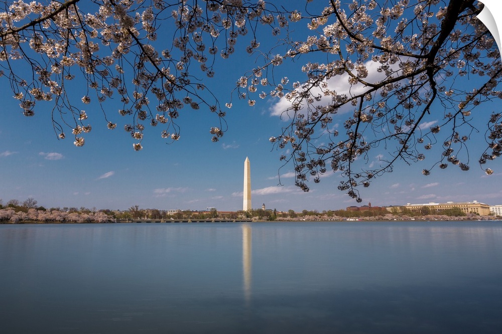 Daytime long exposure of Washington Monument and its reflection in Tidal Basin in the spring.