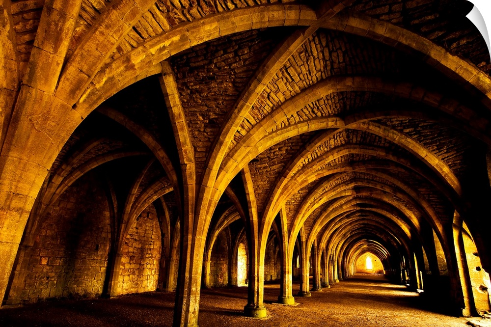 A receeding passage through gothic arches.