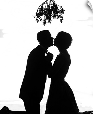 1920's Silhouette Of Couple Kissing Under Christmas Mistletoe