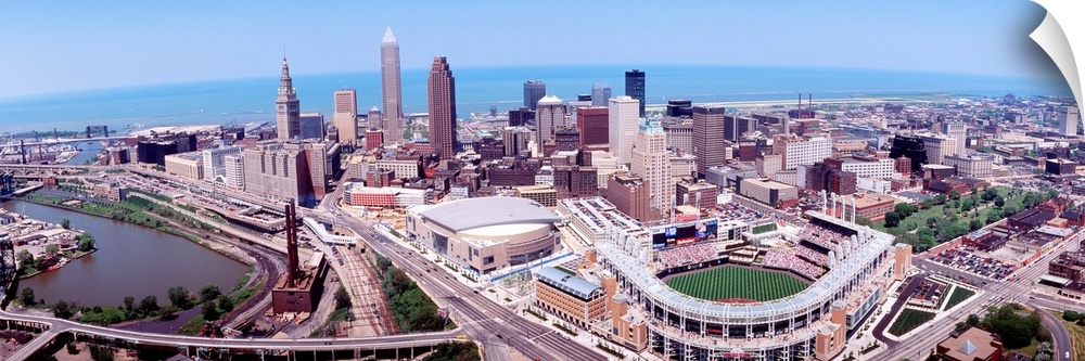 Wide angle aerial photograph of downtown, Lake Erie, and stadium.