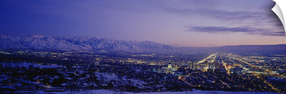 Aerial panorama of Salt Lake City lights at dusk.
