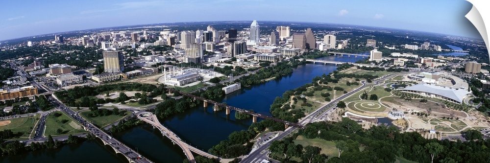 Wide photo from above of the city of Austin, Texas and the Colorado River.