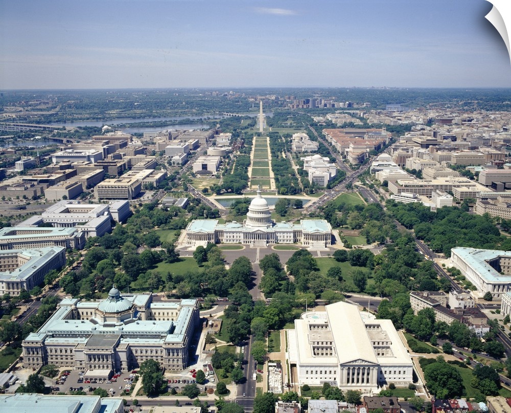High-angle view of the Capital of the United States.  Iconic buildings, monuments, and rivers are visible.