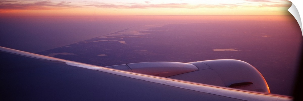 Airplane wing at dusk