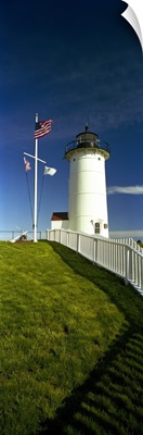 American flags near a lighthouse, Nobska Light, Woods Hole, Cape Cod, Barnstable County, Massachusetts