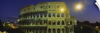 Ancient building lit up at night, Colosseum, Rome, Italy