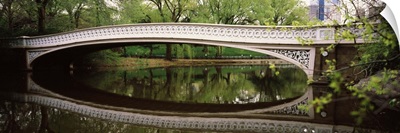 Arch bridge across a lake Central Park Manhattan New York City New York State