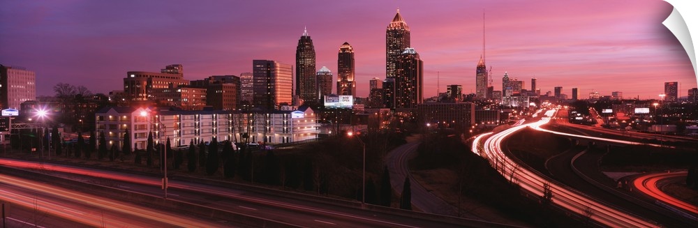 Night panaramic of Atlanta, George skyscrapers with highways running to downtown.