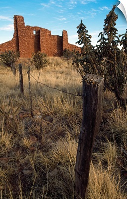 Barbed-wire fence line, hilltop ruins, New Mexico
