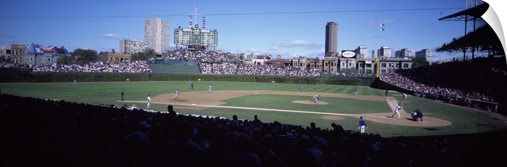 Panoramic photo print of a professional baseball field with a game being played surrounded by spectators in the stands.