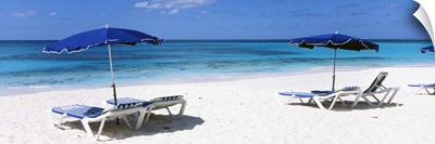 Beach chairs with beach umbrellas on the beach, Shoal Bay Beach, Anguilla