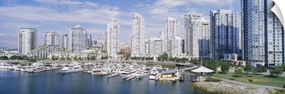 Boats docked at a harbor, False Creek, Granville Island, Vancouver, British Columbia, Canada