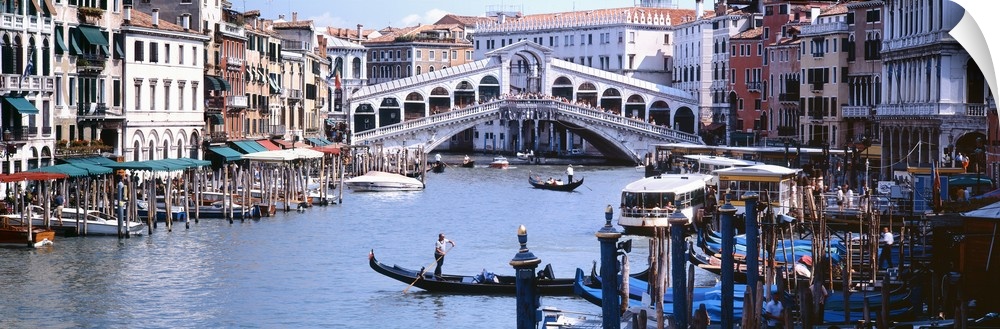 Panoramic photograph of the Grand Canal in Venice, Italy.  View of the Rialto Bridge in the background.