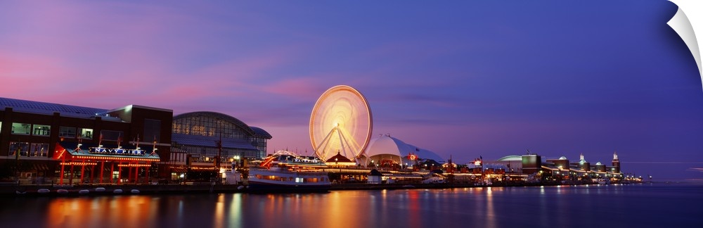 Panoramic photo on canvas of buildings lit up along the waterfront in Chicago with a ferris wheel.