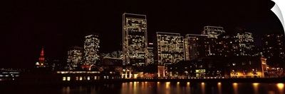 Buildings at the waterfront lit up at night, San Francisco, California, IV