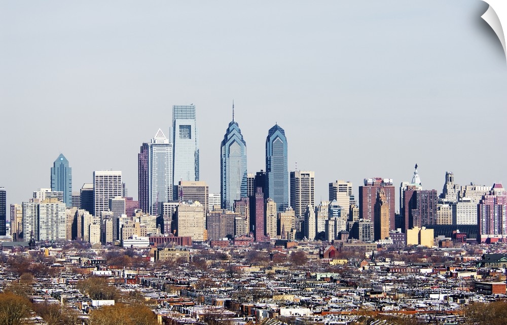 Panoramic photograph of cityscape with tall buildings and skyscrapers.