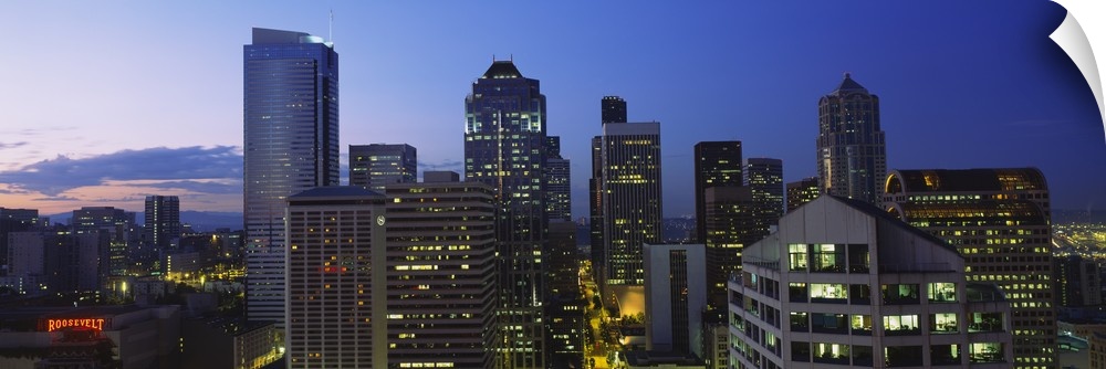 Buildings in a city lit up at dawn, Seattle, Washington State