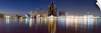 Buildings in a city lit up at dusk, Detroit River, Detroit, Michigan,