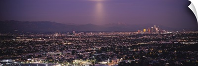 Buildings in a city lit up at dusk, Hollywood, San Gabriel Mountains, City Of Los Angeles, Los Angeles County, California