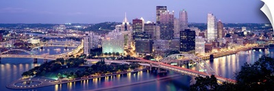 Buildings in a city lit up at dusk, Pittsburgh, Allegheny County, Pennsylvania