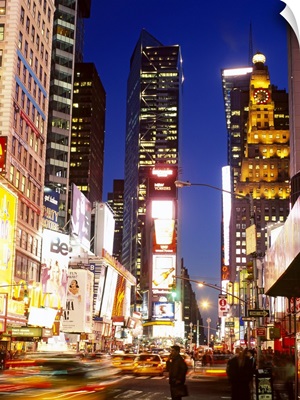 Buildings in a city lit up at dusk, Times Square, Manhattan, New York City, New York State
