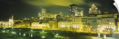 Buildings in a city lit up at night, Auberge Du Vieux Port, Montreal, Quebec, Canada