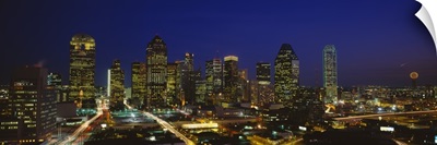 Buildings in a city lit up at night Dallas Texas