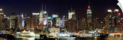 Buildings in a city lit up at night, Hudson River, Midtown Manhattan, Manhattan, New York City, New York State,