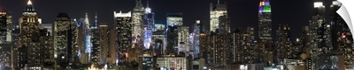 Buildings in a city lit up at night, Midtown Manhattan, Manhattan, New York City, New York State,